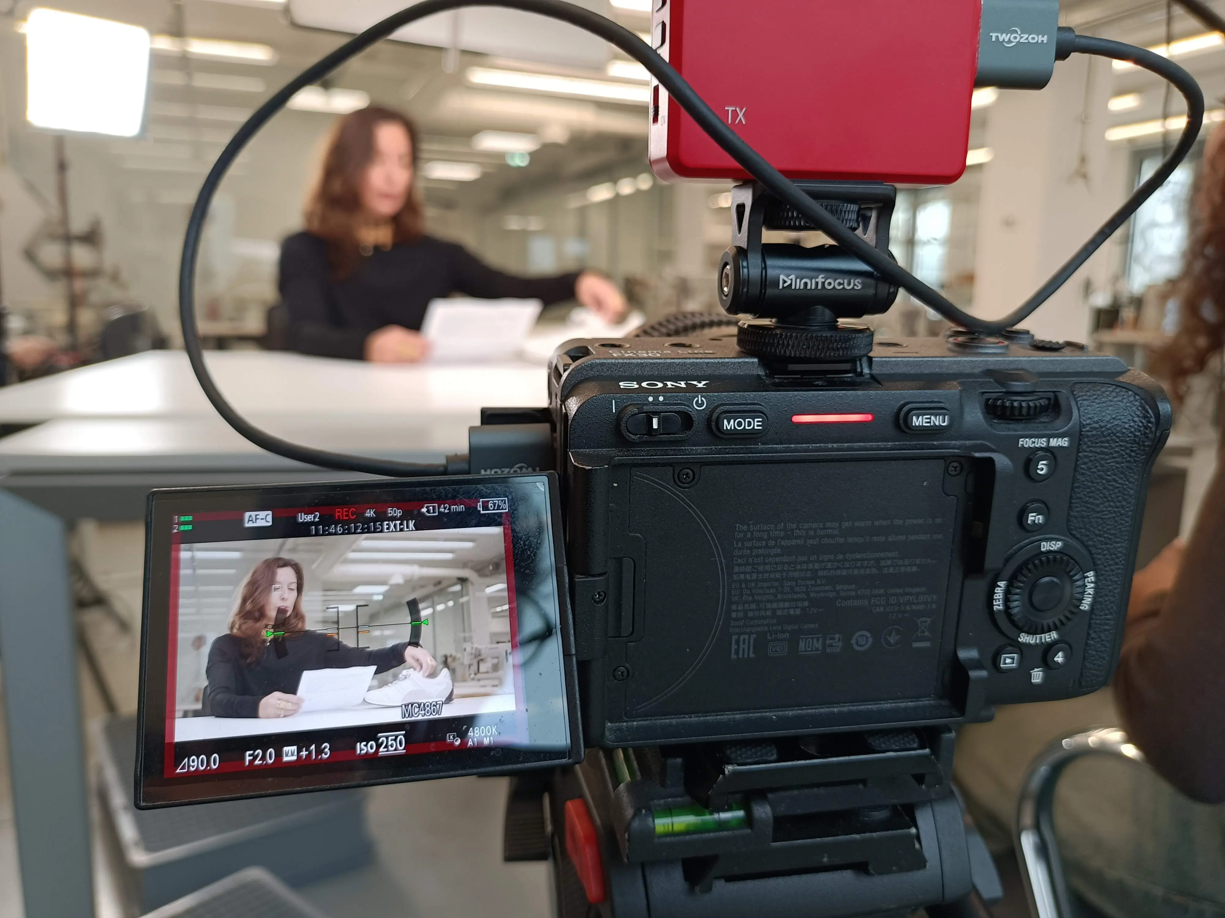 Sony cinema camera and field monitor set up at a workbench during a Dior shoot