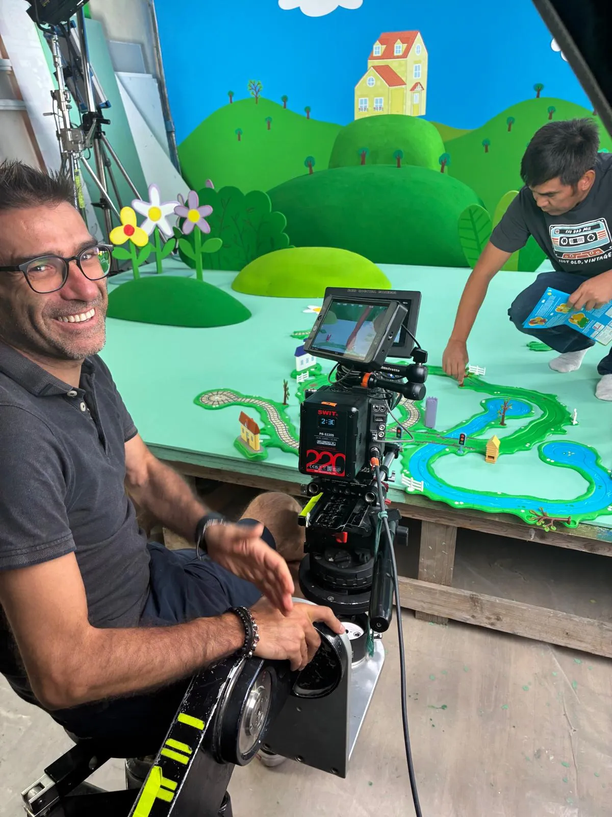 Matteo Castelli at the fluid head filming a miniature set for a children's toy commercial