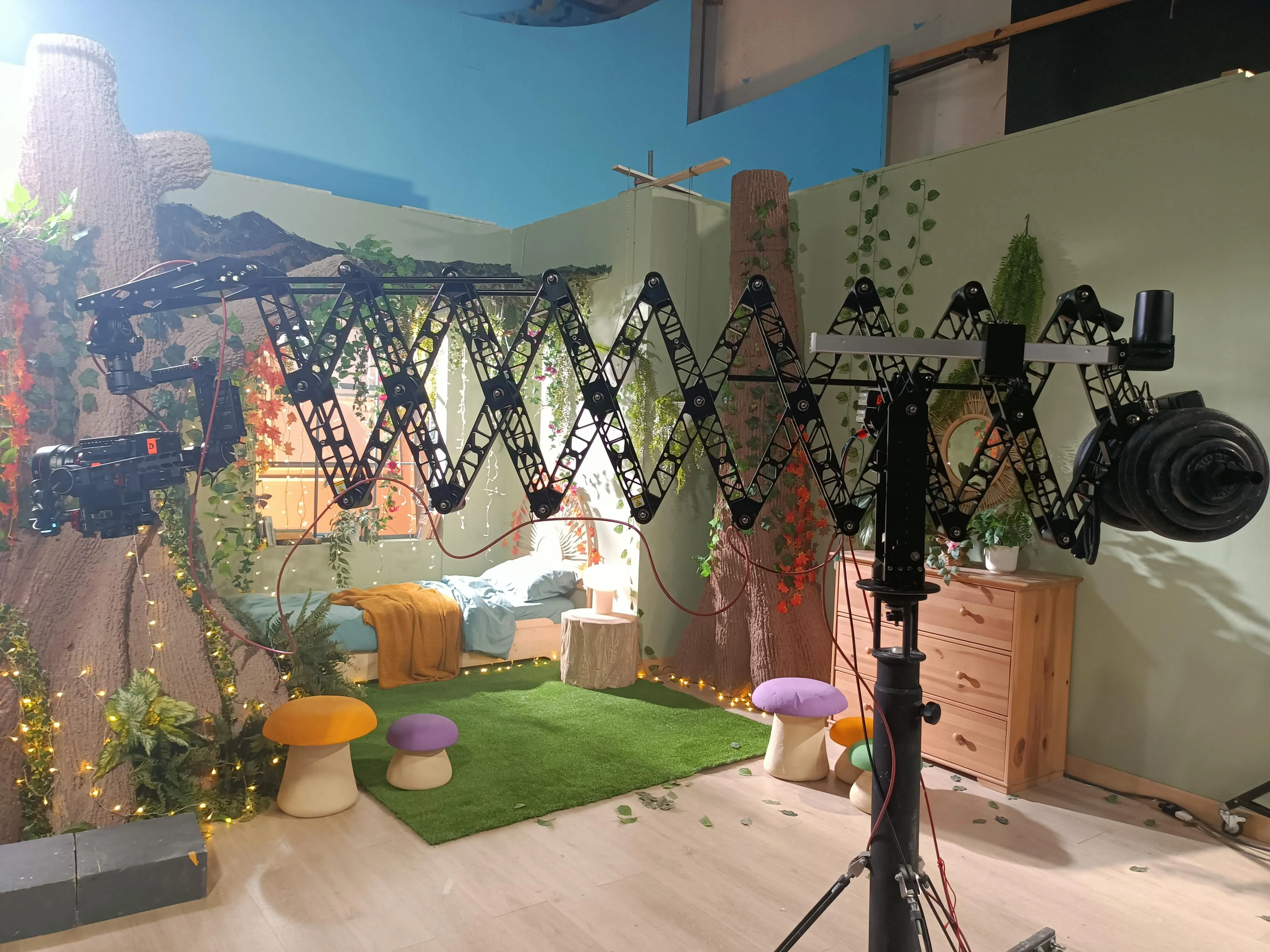 Matteo Castelli's scissor extendable crane rigged with a cinema camera over a fairytale set built in studio