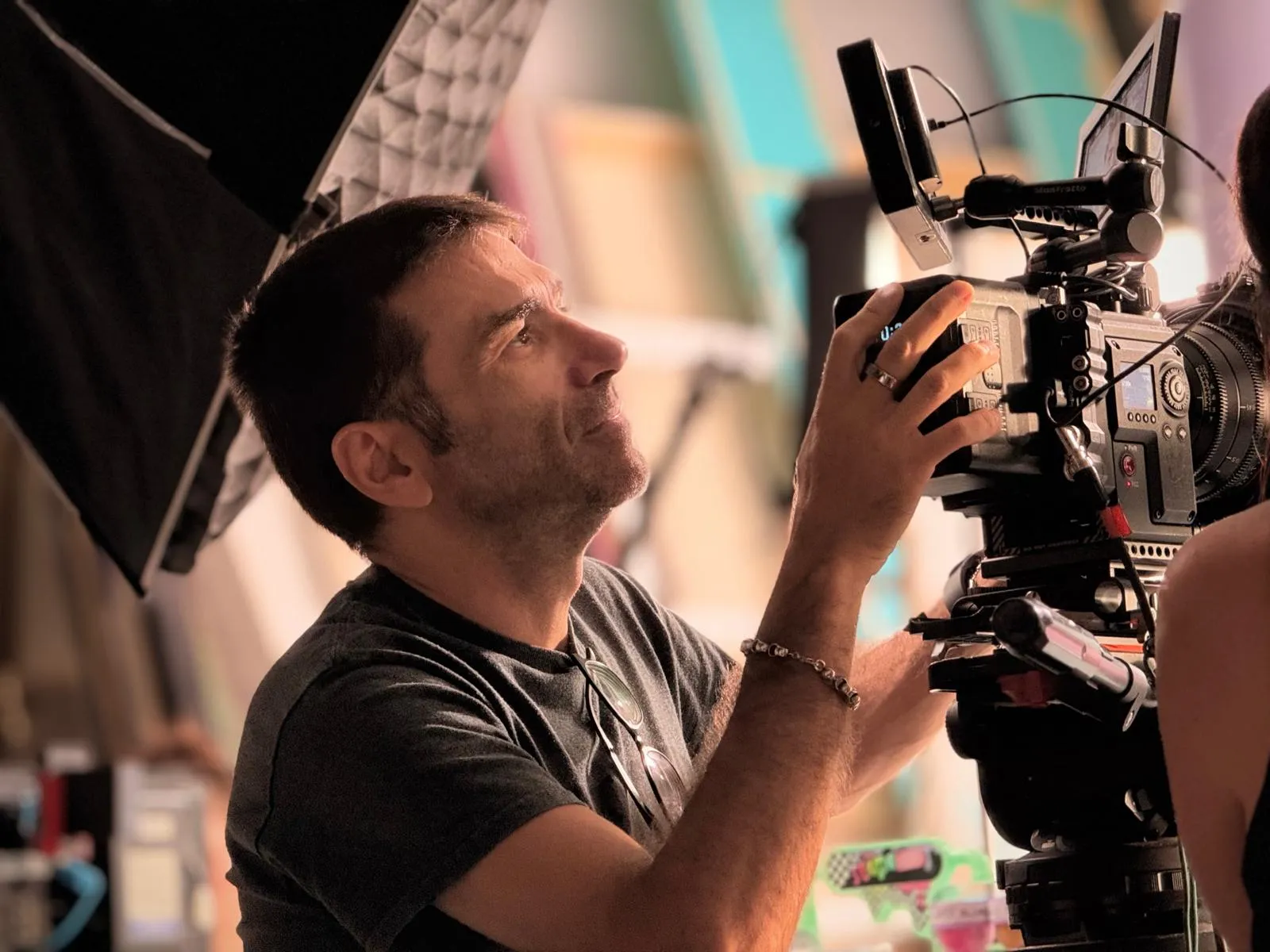 Matteo Castelli, Director of Photography, adjusting a cinema camera on set